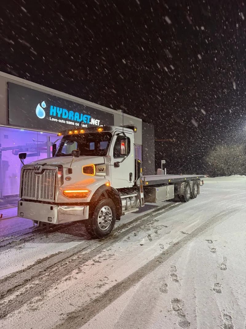 Ottawa Towing Solutions flatbed carrier transporting a vehicle